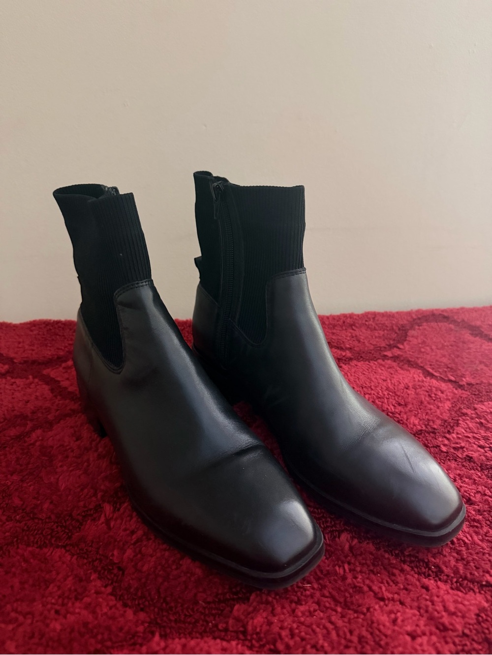 ALDO Kilcooly black leather and knit ankle boots, featuring a distinct sock-like